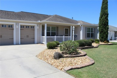 Inviting Sand Dollar model in The Villages' Sanibel neighborhood on Volusia Executive Golf Course  in Florida - for sale on GolfHomes.com, golf home, golf lot