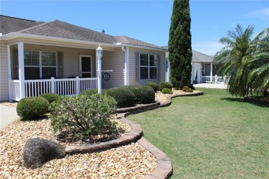 Inviting Sand Dollar model in The Villages' Sanibel neighborhood on Volusia Executive Golf Course  in Florida - for sale on GolfHomes.com, golf home, golf lot