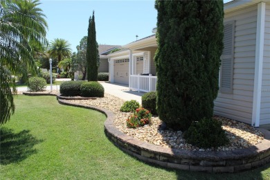 Inviting Sand Dollar model in The Villages' Sanibel neighborhood on Volusia Executive Golf Course  in Florida - for sale on GolfHomes.com, golf home, golf lot