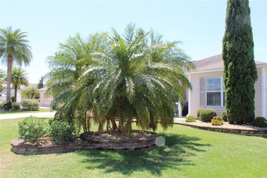 Inviting Sand Dollar model in The Villages' Sanibel neighborhood on Volusia Executive Golf Course  in Florida - for sale on GolfHomes.com, golf home, golf lot