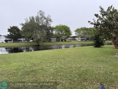 Corner 2-1 1/2 condo, Amazing Water view ALL AROUND. First Floor on Hillsboro Pines Golf in Florida - for sale on GolfHomes.com, golf home, golf lot