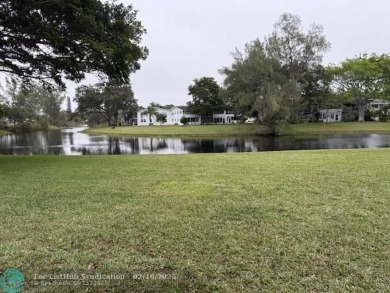 Corner 2-1 1/2 condo, Amazing Water view ALL AROUND. First Floor on Hillsboro Pines Golf in Florida - for sale on GolfHomes.com, golf home, golf lot