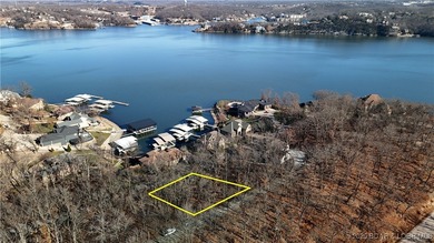 Enjoy breathtaking lake views from this premier building lot in on The Club At Porto Cima in Missouri - for sale on GolfHomes.com, golf home, golf lot