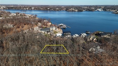 Enjoy breathtaking lake views from this premier building lot in on The Club At Porto Cima in Missouri - for sale on GolfHomes.com, golf home, golf lot