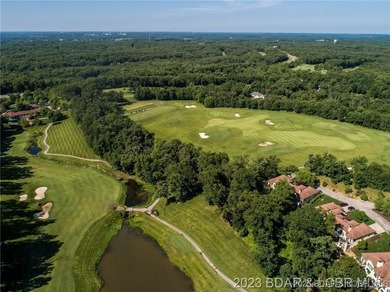 Enjoy breathtaking lake views from this premier building lot in on The Club At Porto Cima in Missouri - for sale on GolfHomes.com, golf home, golf lot