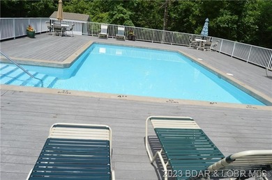 Enjoy breathtaking lake views from this premier building lot in on The Club At Porto Cima in Missouri - for sale on GolfHomes.com, golf home, golf lot