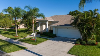 Overlooking the 10th green in the highly desired Viera East Golf on Viera East Golf Club in Florida - for sale on GolfHomes.com, golf home, golf lot