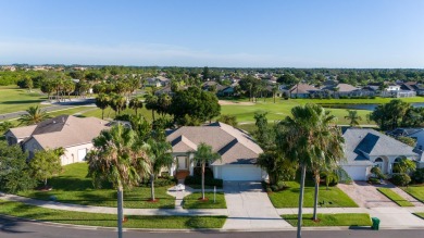 Overlooking the 10th green in the highly desired Viera East Golf on Viera East Golf Club in Florida - for sale on GolfHomes.com, golf home, golf lot