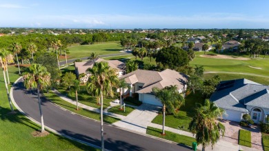 Overlooking the 10th green in the highly desired Viera East Golf on Viera East Golf Club in Florida - for sale on GolfHomes.com, golf home, golf lot