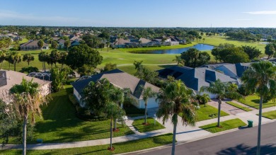 Overlooking the 10th green in the highly desired Viera East Golf on Viera East Golf Club in Florida - for sale on GolfHomes.com, golf home, golf lot