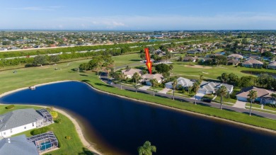 Overlooking the 10th green in the highly desired Viera East Golf on Viera East Golf Club in Florida - for sale on GolfHomes.com, golf home, golf lot