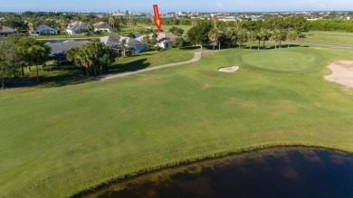 Overlooking the 10th green in the highly desired Viera East Golf on Viera East Golf Club in Florida - for sale on GolfHomes.com, golf home, golf lot