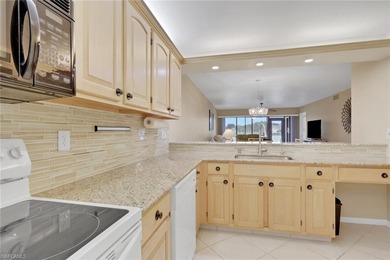 This well-appointed first-floor condo has stunning lake views on Riviera Golf Club in Florida - for sale on GolfHomes.com, golf home, golf lot