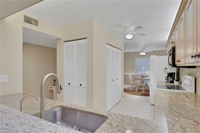 This well-appointed first-floor condo has stunning lake views on Riviera Golf Club in Florida - for sale on GolfHomes.com, golf home, golf lot