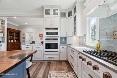 Set on a rare 1.98-acre peninsula at the convergence of the on Sound Golf Links at Albemarle Plantation in North Carolina - for sale on GolfHomes.com, golf home, golf lot