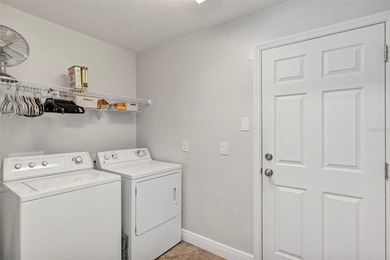 This 2 bedroom, 2 bath concrete block & stucco villa with on Arlington Ridge Golf Club in Florida - for sale on GolfHomes.com, golf home, golf lot