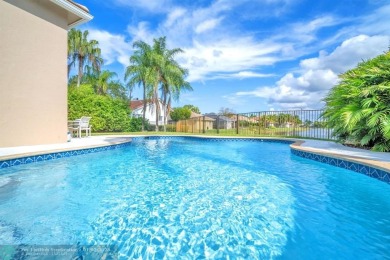 Don't miss out on this move-in ready Weston Hills home! Located on Weston Hills Country Club in Florida - for sale on GolfHomes.com, golf home, golf lot