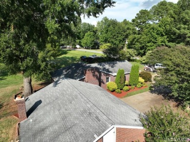 Reasonably priced Lake Gaston home with launch ramp behind the on Myrick Hills Country Club in North Carolina - for sale on GolfHomes.com, golf home, golf lot