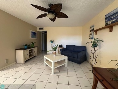 UNIT WITH NEW AIR CONDITIONING, NEW WATER HEATER, NEW FRENCH on Hillsboro Pines Golf in Florida - for sale on GolfHomes.com, golf home, golf lot