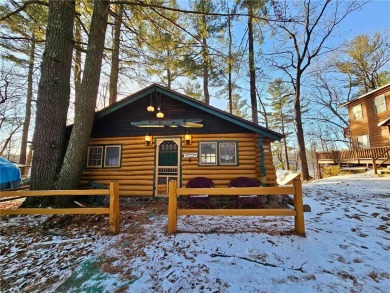Cozy log cabin situated on pristine Long Lake. Open concept on Butternut Hills Golf Course in Wisconsin - for sale on GolfHomes.com, golf home, golf lot