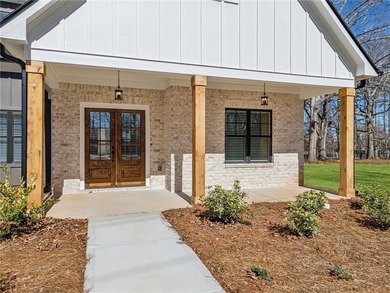 Nestled in the prestigious gated community of The Orchard in on The Orchard Golf and Country Club in Georgia - for sale on GolfHomes.com, golf home, golf lot