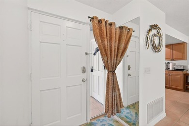 Wake up to sweeping golf course views in this bright, breezy on East Bay Golf Club in Florida - for sale on GolfHomes.com, golf home, golf lot