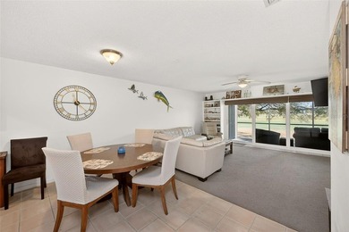 Wake up to sweeping golf course views in this bright, breezy on East Bay Golf Club in Florida - for sale on GolfHomes.com, golf home, golf lot