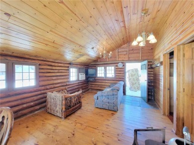 Cozy log cabin situated on pristine Long Lake. Open concept on Butternut Hills Golf Course in Wisconsin - for sale on GolfHomes.com, golf home, golf lot