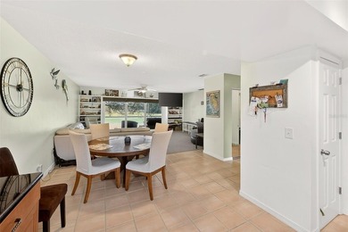 Wake up to sweeping golf course views in this bright, breezy on East Bay Golf Club in Florida - for sale on GolfHomes.com, golf home, golf lot