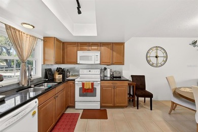 Wake up to sweeping golf course views in this bright, breezy on East Bay Golf Club in Florida - for sale on GolfHomes.com, golf home, golf lot