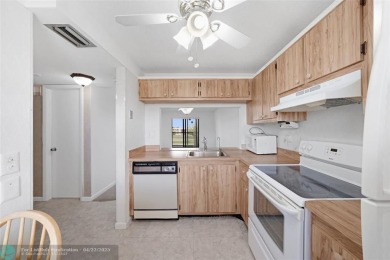 Top-floor 2BD/2BA condo in Sunrise Lakes Phase 4, a 55+ on Sunrise Lakes Phase IV Golf Course in Florida - for sale on GolfHomes.com, golf home, golf lot