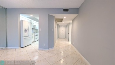 Embrace the vibrant 55+ lifestyle in South Florida's best-kept on Wynmoor Golf Course in Florida - for sale on GolfHomes.com, golf home, golf lot