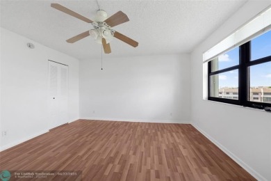 Top-floor 2BD/2BA condo in Sunrise Lakes Phase 4, a 55+ on Sunrise Lakes Phase IV Golf Course in Florida - for sale on GolfHomes.com, golf home, golf lot