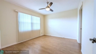 Embrace the vibrant 55+ lifestyle in South Florida's best-kept on Wynmoor Golf Course in Florida - for sale on GolfHomes.com, golf home, golf lot