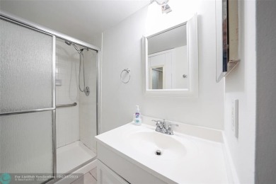 Top-floor 2BD/2BA condo in Sunrise Lakes Phase 4, a 55+ on Sunrise Lakes Phase IV Golf Course in Florida - for sale on GolfHomes.com, golf home, golf lot