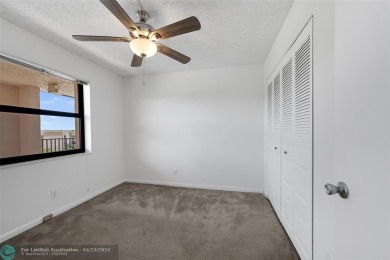 Top-floor 2BD/2BA condo in Sunrise Lakes Phase 4, a 55+ on Sunrise Lakes Phase IV Golf Course in Florida - for sale on GolfHomes.com, golf home, golf lot
