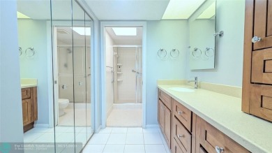 Embrace the vibrant 55+ lifestyle in South Florida's best-kept on Wynmoor Golf Course in Florida - for sale on GolfHomes.com, golf home, golf lot