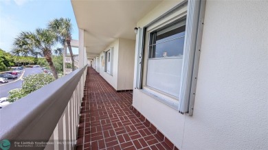 Embrace the vibrant 55+ lifestyle in South Florida's best-kept on Wynmoor Golf Course in Florida - for sale on GolfHomes.com, golf home, golf lot