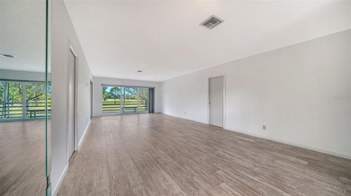 Rarely available and generously proportioned, this three-bedroom on Palm Aire Country Club of Sarasota in Florida - for sale on GolfHomes.com, golf home, golf lot