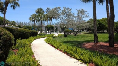 Embrace the vibrant 55+ lifestyle in South Florida's best-kept on Wynmoor Golf Course in Florida - for sale on GolfHomes.com, golf home, golf lot