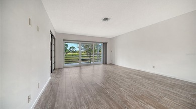 Rarely available and generously proportioned, this three-bedroom on Palm Aire Country Club of Sarasota in Florida - for sale on GolfHomes.com, golf home, golf lot