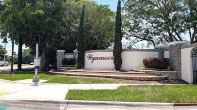 Embrace the vibrant 55+ lifestyle in South Florida's best-kept on Wynmoor Golf Course in Florida - for sale on GolfHomes.com, golf home, golf lot