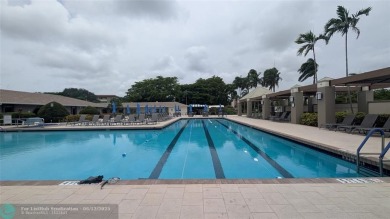 Embrace the vibrant 55+ lifestyle in South Florida's best-kept on Wynmoor Golf Course in Florida - for sale on GolfHomes.com, golf home, golf lot