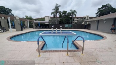 Embrace the vibrant 55+ lifestyle in South Florida's best-kept on Wynmoor Golf Course in Florida - for sale on GolfHomes.com, golf home, golf lot