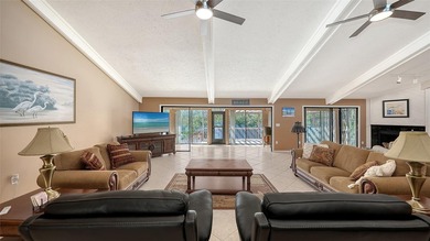 Wrapped in lush, mature landscaping and set along a tranquil on Longboat Key Golf Club Resort in Florida - for sale on GolfHomes.com, golf home, golf lot