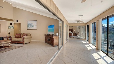 Wrapped in lush, mature landscaping and set along a tranquil on Longboat Key Golf Club Resort in Florida - for sale on GolfHomes.com, golf home, golf lot
