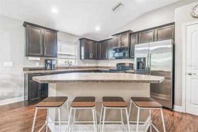 Beautifully maintained and decorated with style, this on Meadow Oaks Golf and Country Club in Florida - for sale on GolfHomes.com, golf home, golf lot