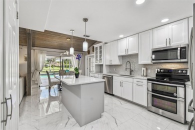 Your DREAM home awaits in the heart of beautiful CARROLLWOOD on Carrollwood Country Club in Florida - for sale on GolfHomes.com, golf home, golf lot
