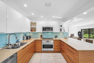 Welcome to this beautifully updated second-floor residence in on Quail Ridge Golf Course and Country Club in Florida - for sale on GolfHomes.com, golf home, golf lot