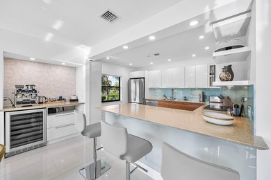 Welcome to this beautifully updated second-floor residence in on Quail Ridge Golf Course and Country Club in Florida - for sale on GolfHomes.com, golf home, golf lot